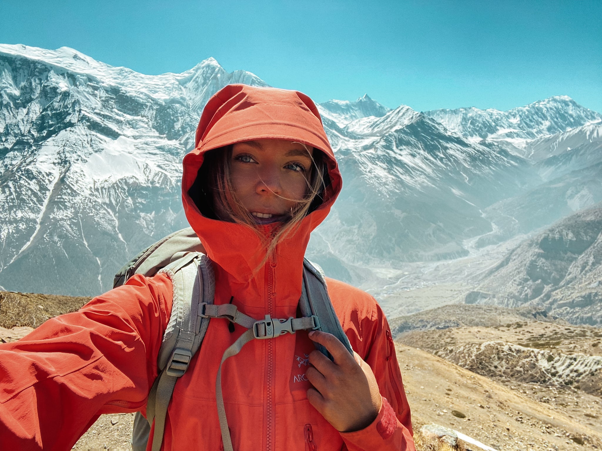 Women summiting a peak in Nepal with technical mountaineering equipment on