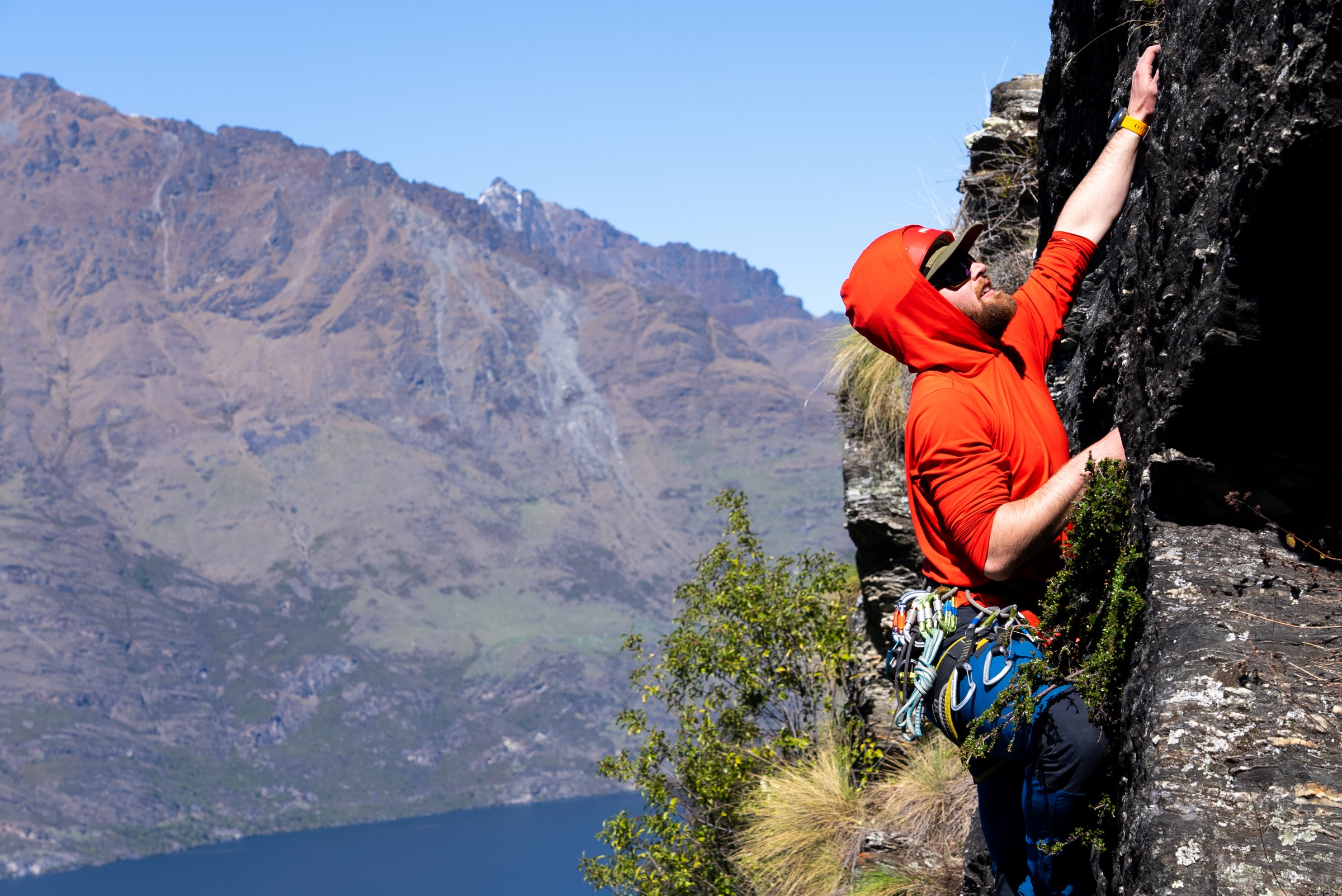 Our instructor showing students the ropes while rock climbing in Queenstown